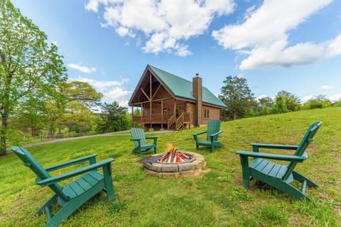 Blazing firepit with four Adirondack chairs, perfect for relaxing and enjoying peaceful Smoky Mountain nights