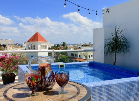 Enjoy a sangria while lounging in your private rooftop pool with ocean view