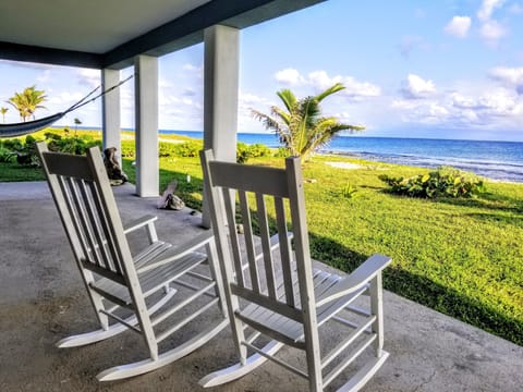 Ahhhh, the perfect way to relax is on this private patio, listening to the waves