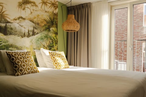 Deluxe Room | In-room safe, individually decorated, desk, blackout drapes