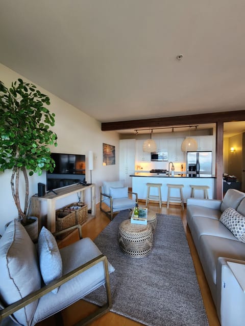 Charming and very coastal feel to your living room and kitchen!