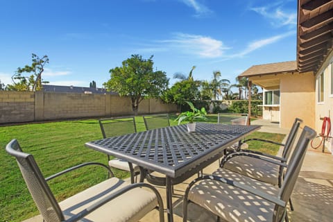 Enjoy this gorgeous fenced in backyard and outdoor sitting area