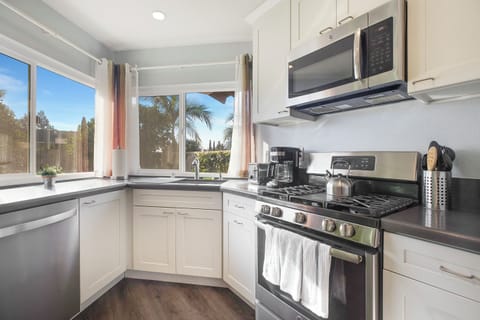 Gourmet Kitchen with top of the line appliances and cooking utensils