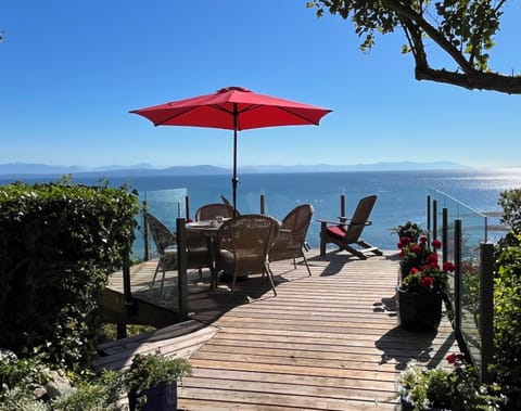 South/east facing deck overlooking the beach, Salish Sea and mainland mountains