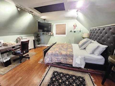 Queens size bed
Hanging Smart TV 
Desk and Chair