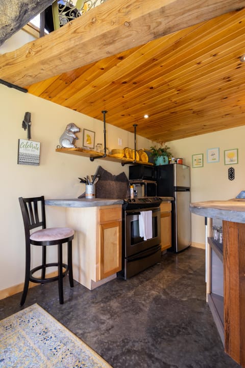 Modern kitchen with range, microwave, refrigerator and dishwasher..