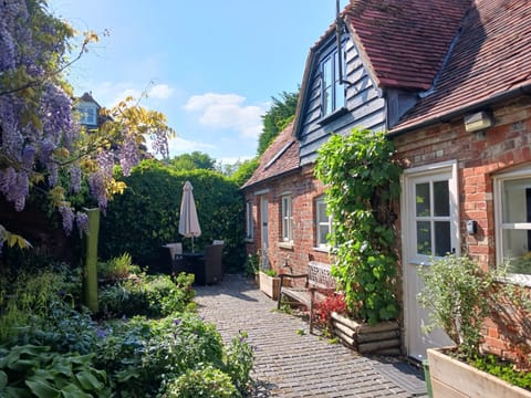 Front view of the cottage with the walled garden