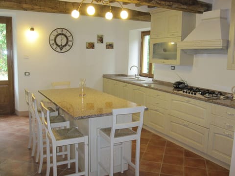 Kitchen which leads to upper garden, Gazebo and cool open Stone fire