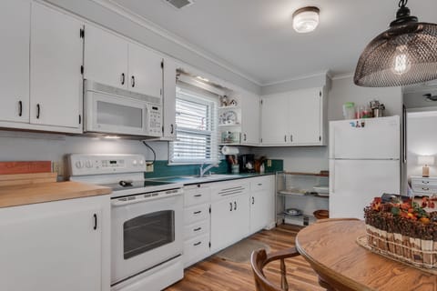 Stove, microwave and refrigerator. 
Built-in dish-washing soap dispenser