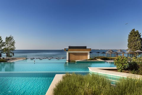 Indoor pool, outdoor pool, pool umbrellas, sun loungers