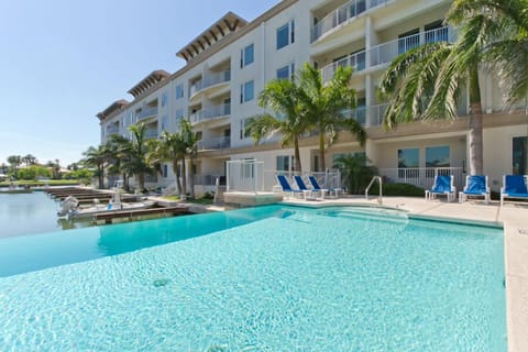Spend your days lounging by the waterfront infinity pool and relaxing in the hot tub.