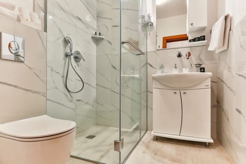 Family Quadruple Room, Multiple Beds, Non Smoking, City View | Bathroom | Shower, hair dryer, towels