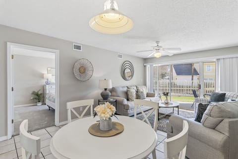 Spacious Living Room and Dining Area Offering a View of the Neighborhood
