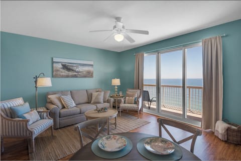 Relax in your coastal haven with panoramic ocean views, comfortable seating, and gentle sea breezes from your private balcony.