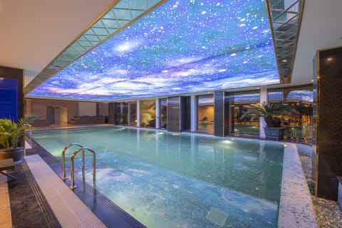 Indoor pool, open 6:00 AM to 10:00 PM, pool umbrellas, sun loungers