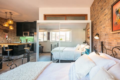 Family Apartment, 1 Bedroom, City View | 1 bedroom, in-room safe, individually decorated, individually furnished