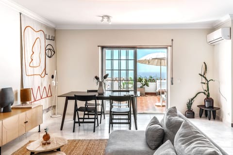 Bright living room with Ericeira view