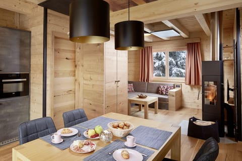 Comfort Chalet, 1 Bedroom | Living area | 35-inch flat-screen TV with cable channels, TV, tablet