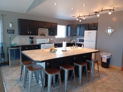 Penthouse Suite | Private kitchenette | Fridge, microwave, coffee/tea maker, toaster