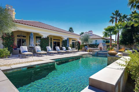 Welcome to Legends! Private, resort-style backyard with fireplace, custom BBQ island, ample seating and al fresco dining.