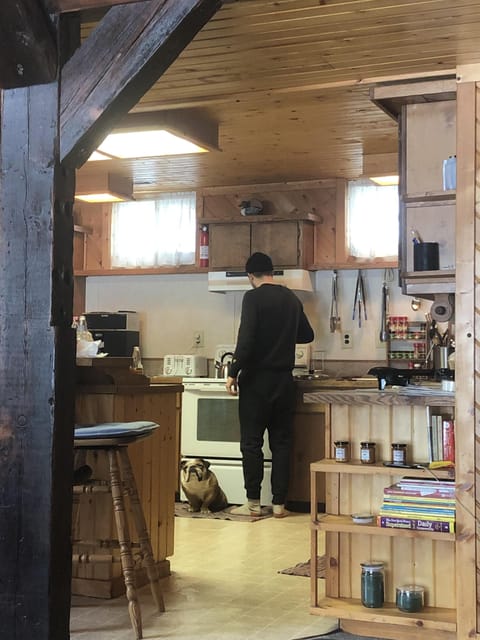 Man and his best friend cooking breakfast for the group!