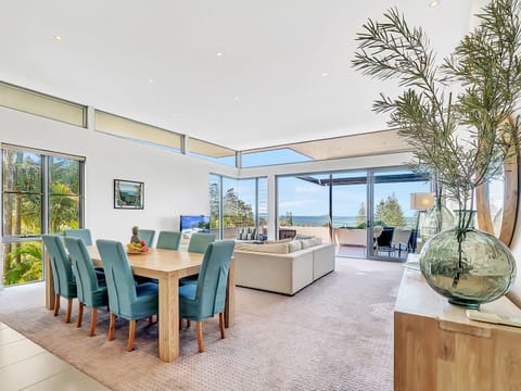 Spacious living area with superb ocean views opens to large patio 