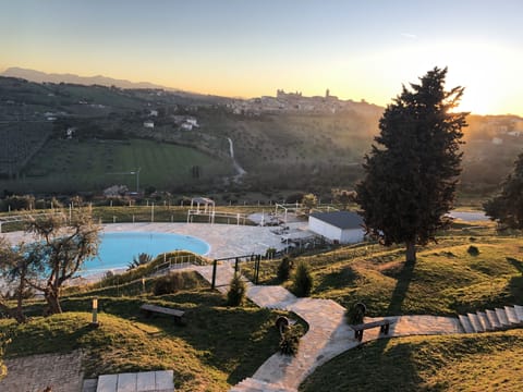 Seasonal outdoor pool, open 8:00 AM to 7:00 PM, sun loungers