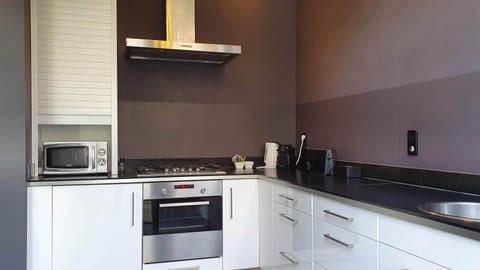 Standard Apartment | Private kitchen | Espresso maker, dining tables