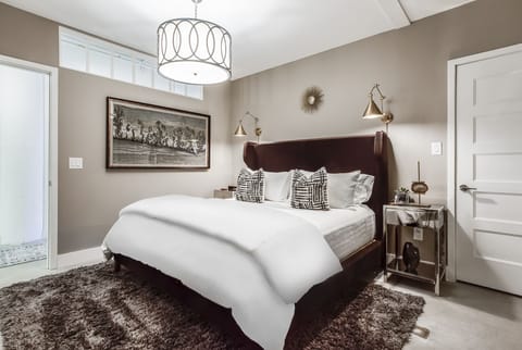 Master Bedroom with Shag Rug and Large Bed at Sherwood Loft