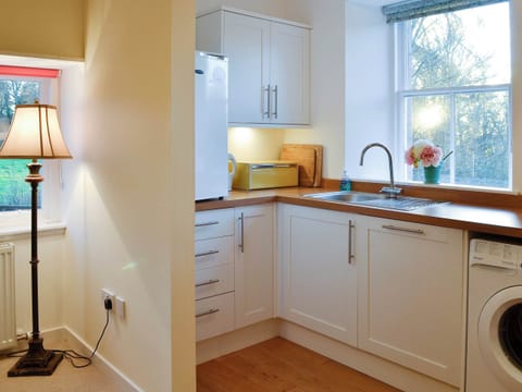 Modest yet well-equipped kitchen | Dairy Cottage, Whitehouse, near Alford