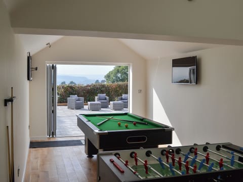 Games room opening onto the terrace | Estuary View, Exmouth