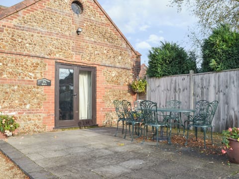 Paved patio area | Littlewoods Barn - Moor Farm Stable Cottages, Foxley, near Fakenham