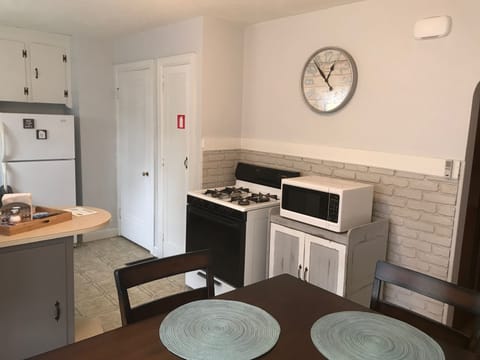 Gas oven/stove and microwave for all your cooking needs.