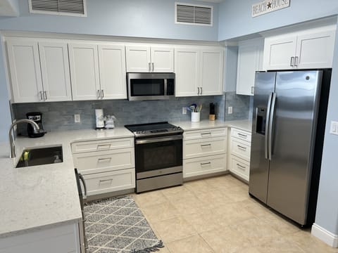 Newly Renovated Kitchen with all new appliances, Kitchen cabinets, and quartz.