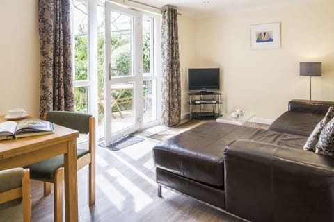 The lounge looks straight out onto the garden & BBQ area.