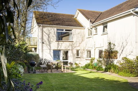 Longships apartment can be seen at end of the garden.