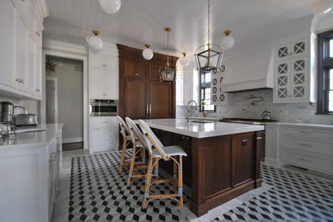 Incredible custom kitchen with commercial grade appliances, marble mosaic floor, quartzite counters and walnut island.