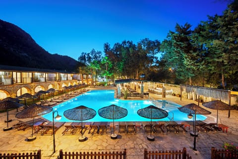 Seasonal outdoor pool, open 9:00 AM to 7:00 PM, pool umbrellas