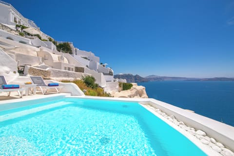 Seasonal outdoor pool, open 11:00 AM to 9:30 PM, pool umbrellas