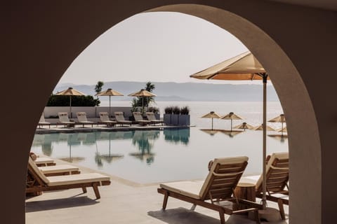 Seasonal outdoor pool, open 10:00 AM to 6:00 PM, pool umbrellas