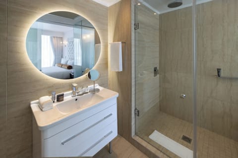 Separate tub and shower, hydromassage showerhead, designer toiletries