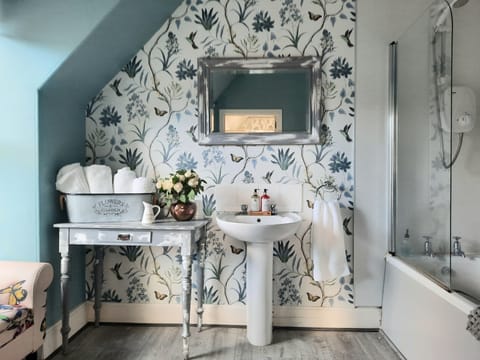 Botanical Suite - King/Twin | Bathroom | Combined shower/tub, eco-friendly toiletries, hair dryer, bathrobes