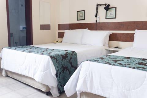 Deluxe Triple Room | Iron/ironing board, free WiFi, bed sheets