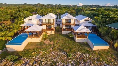 Even with a full house of 24 guests, the aerial layout shows multiple distinct zones—like the private balconies, the massive main deck, and separate living areas—ensuring it never feels crowded.