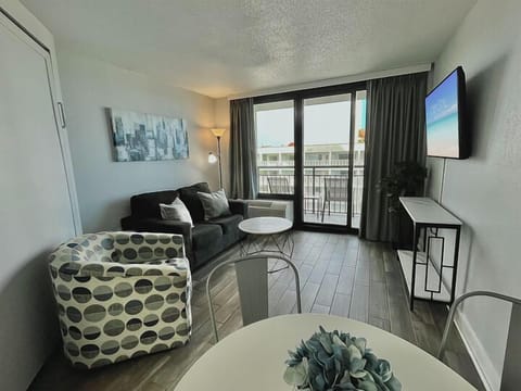 Indulge in beachfront bliss in our suite. Boasting a comfortable couch in the living area, providing the ultimate coastal comfort.