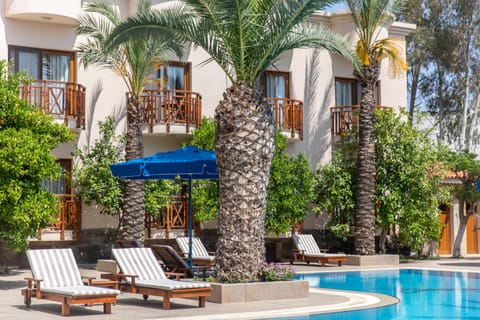 Outdoor pool, open 9:00 AM to 7:00 PM, pool umbrellas, sun loungers