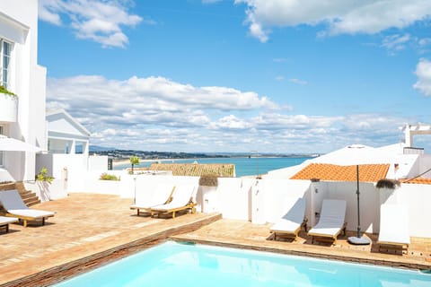 Outdoor pool, pool umbrellas, sun loungers