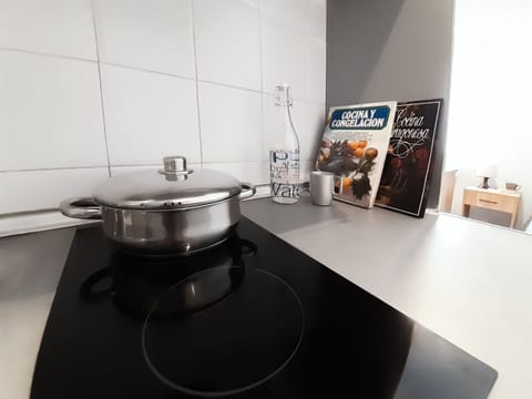 Full-size fridge, microwave, stovetop, cookware/dishes/utensils