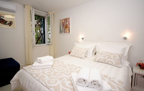 Apartment, Balcony | 2 bedrooms, in-room safe, individually decorated, individually furnished