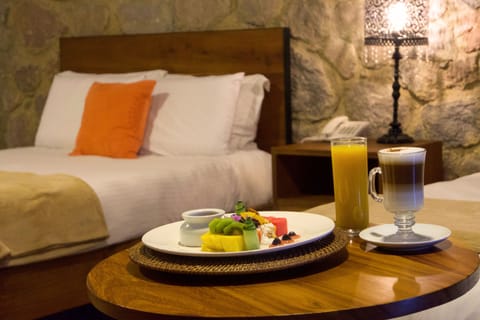 Standard Quadruple Room, Garden View | Minibar, in-room safe, free WiFi, bed sheets